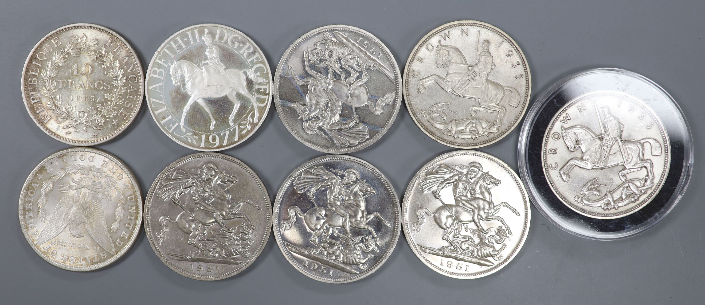 Five 1951 crowns, EF, two 1935 crowns, AEF, a silver 1977 crown, an 1885 Morgan dollar, GVF and a 1965 French Ten Francs, EF